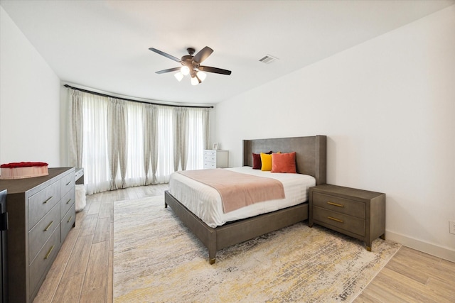 bedroom featuring ceiling fan and light hardwood / wood-style flooring