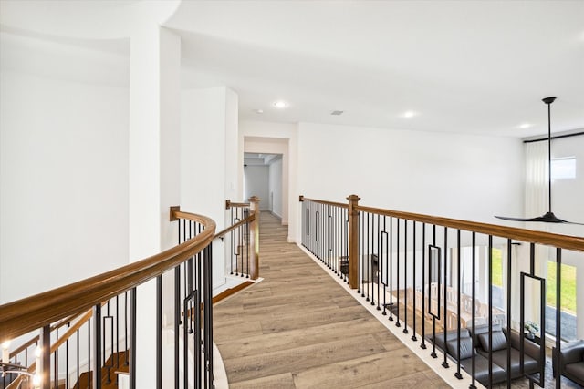 hall with light hardwood / wood-style flooring