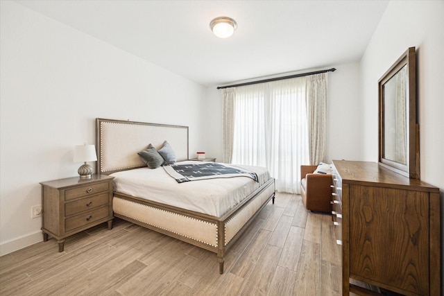 bedroom featuring light wood-type flooring