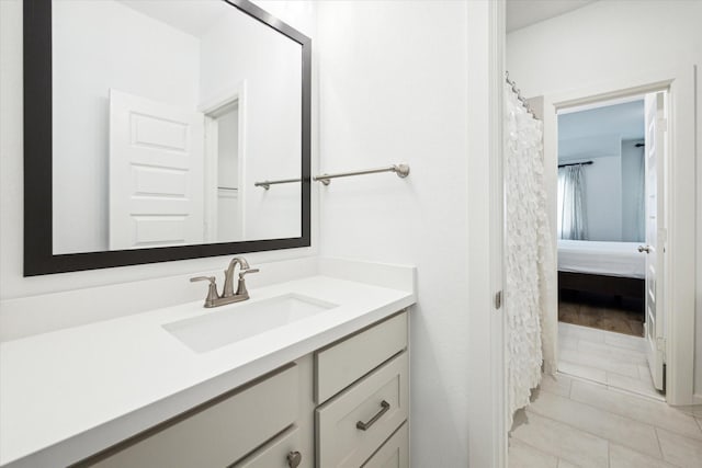 bathroom with tile patterned flooring and vanity