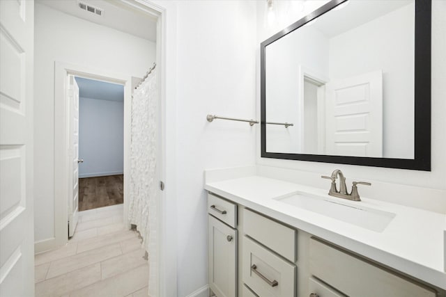 bathroom featuring vanity and tile patterned flooring