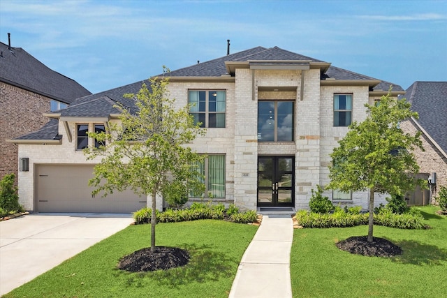 view of front of house featuring a garage, a front lawn, and french doors