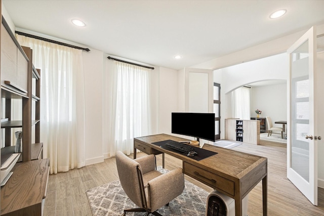 office featuring french doors and light hardwood / wood-style flooring