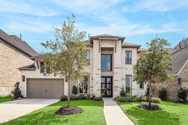 view of front of house with a garage, french doors, and a front yard