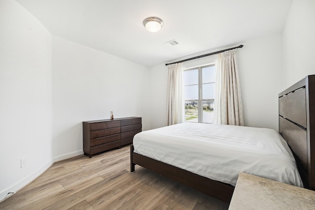 bedroom with light hardwood / wood-style floors