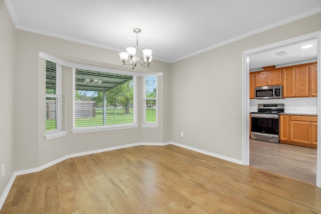 interior space with light wood-type flooring, plenty of natural light, a chandelier, and crown molding