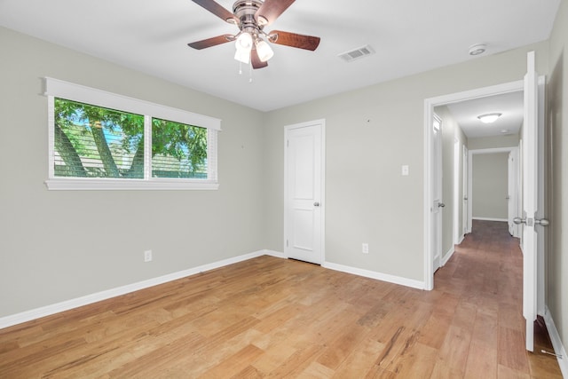 unfurnished bedroom with hardwood / wood-style flooring and ceiling fan