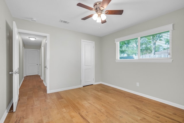 unfurnished bedroom featuring ceiling fan and light hardwood / wood-style floors