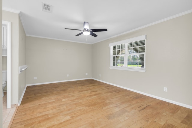 empty room featuring ornamental molding, light hardwood / wood-style flooring, and ceiling fan