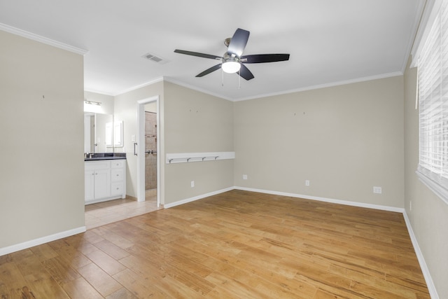 interior space with light hardwood / wood-style flooring, ceiling fan, and ornamental molding