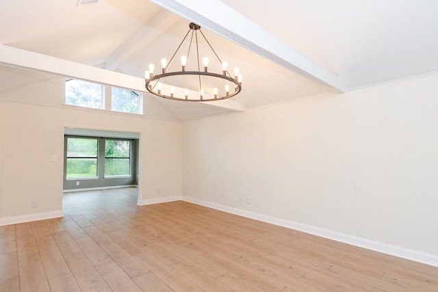 spare room featuring a notable chandelier, light hardwood / wood-style flooring, beam ceiling, and high vaulted ceiling