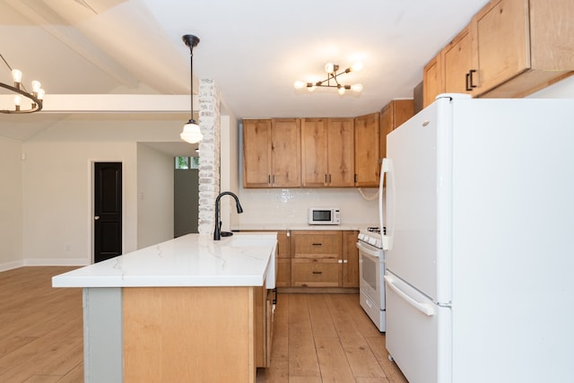 kitchen featuring a notable chandelier, white appliances, light wood-type flooring, hanging light fixtures, and decorative backsplash