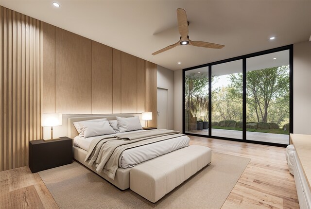 bedroom featuring access to outside, floor to ceiling windows, ceiling fan, and light hardwood / wood-style flooring