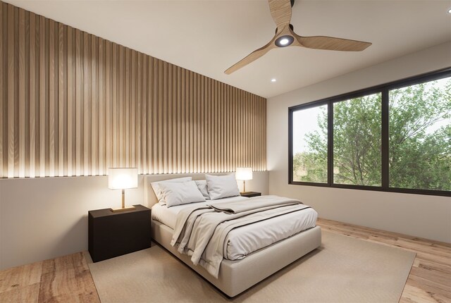 bedroom with hardwood / wood-style flooring and ceiling fan