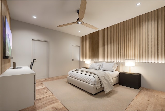 bedroom featuring a ceiling fan, light wood-type flooring, and recessed lighting