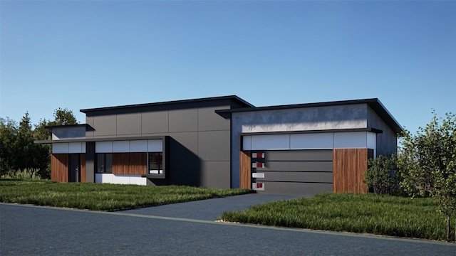 view of front facade featuring concrete driveway and a garage