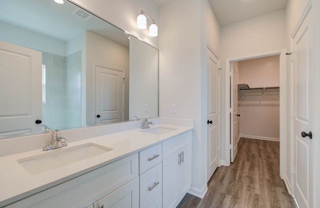 bathroom with vanity and hardwood / wood-style flooring