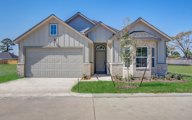 view of front facade with a front yard and a garage