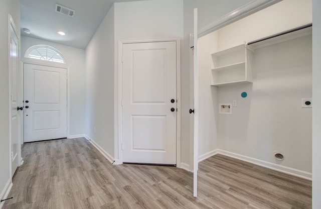 clothes washing area with light wood-type flooring, washer hookup, and electric dryer hookup