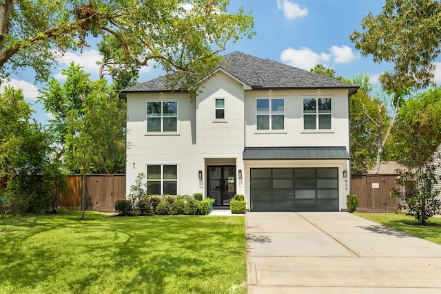 view of front facade featuring a front lawn and a garage