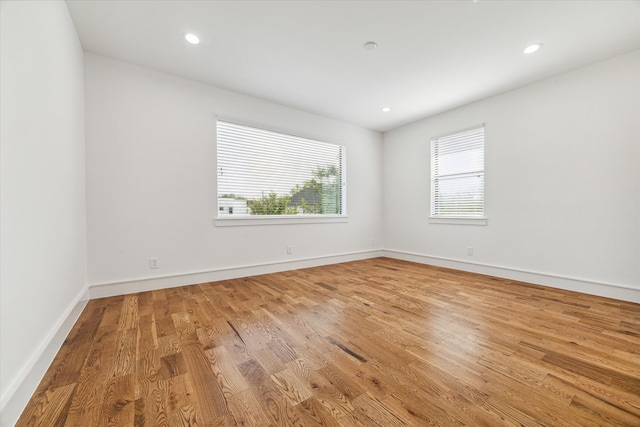 spare room featuring light wood-type flooring