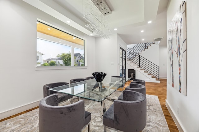 living room featuring a chandelier and hardwood / wood-style floors