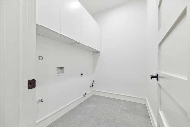 washroom featuring washer hookup, gas dryer hookup, hookup for an electric dryer, and cabinets