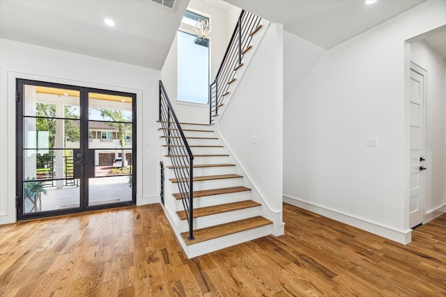 stairway featuring hardwood / wood-style flooring