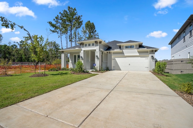 view of front of property with a garage and a front lawn