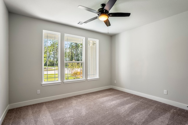 spare room with carpet flooring and ceiling fan