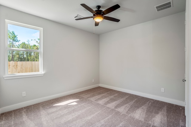 carpeted empty room featuring ceiling fan