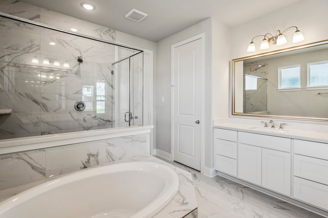 bathroom with vanity, shower with separate bathtub, and tile patterned floors