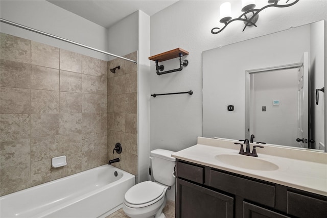 bathroom with toilet, bathtub / shower combination, and vanity