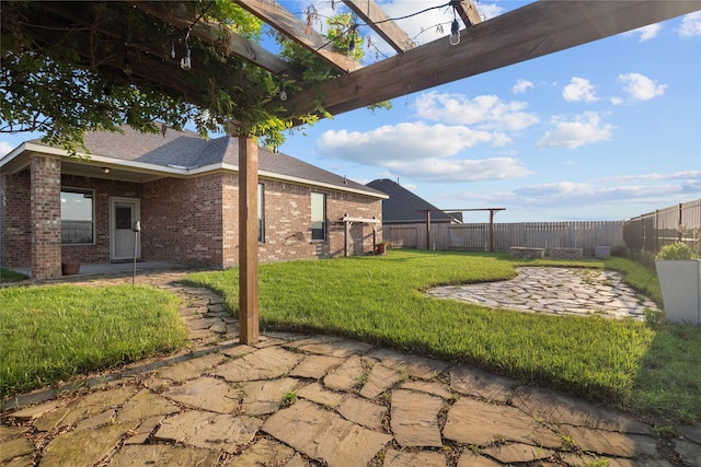 view of yard featuring a patio area and a fenced backyard