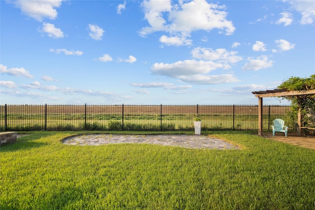 view of yard with a rural view and fence