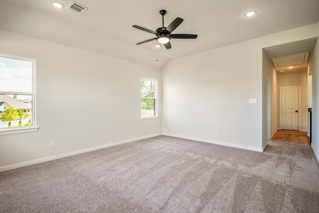 carpeted empty room featuring lofted ceiling and ceiling fan