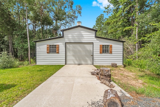 garage with a lawn