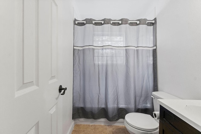 full bath with toilet, tile patterned floors, shower / bathtub combination with curtain, and vanity