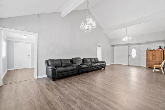 living room with an inviting chandelier, high vaulted ceiling, beamed ceiling, and wood-type flooring