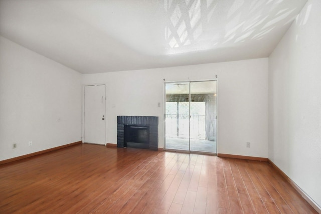 unfurnished living room featuring hardwood / wood-style floors