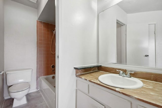 full bathroom with vanity, toilet, tiled shower / bath, and tile patterned flooring