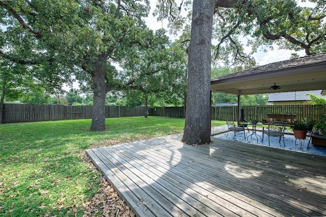 wooden terrace with a yard