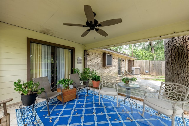 view of patio / terrace with central AC and ceiling fan