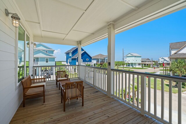 wooden terrace with a porch