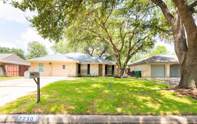 ranch-style house with a front yard and a garage