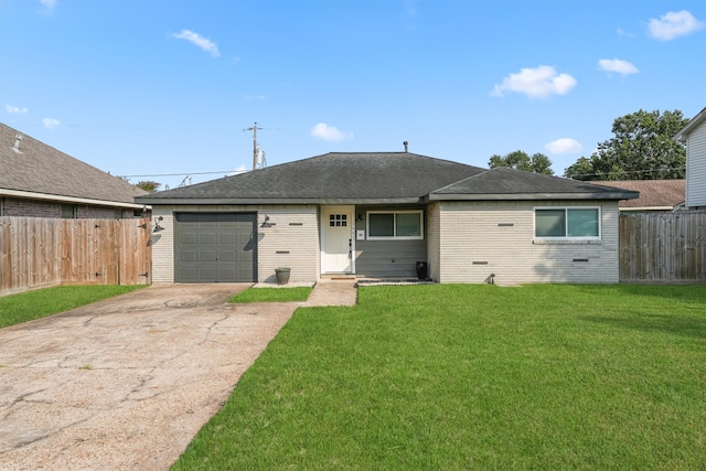 ranch-style home featuring a garage and a front lawn