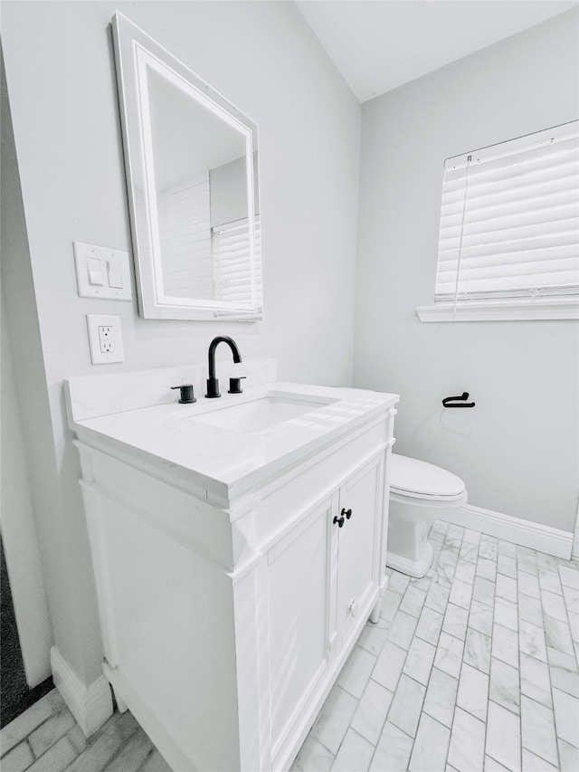 bathroom with vanity and toilet