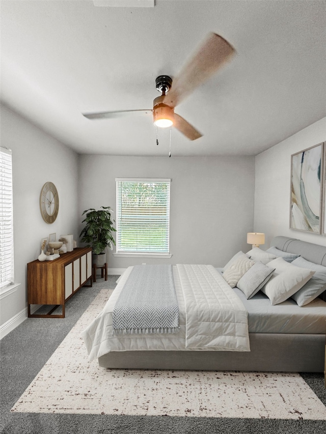 bedroom with ceiling fan and carpet floors