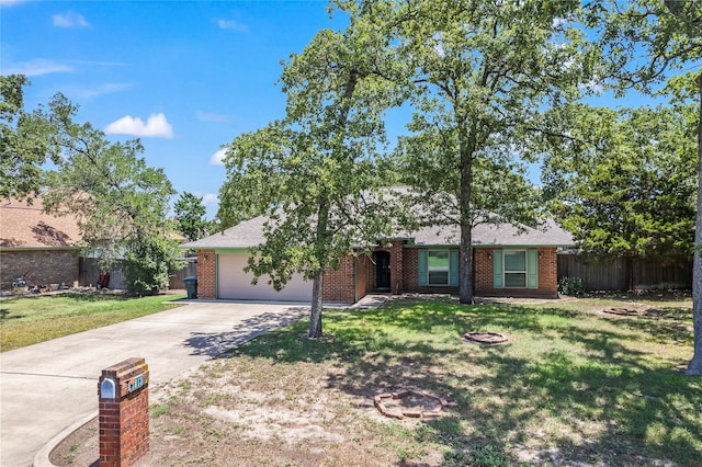 ranch-style house with a garage and a front lawn