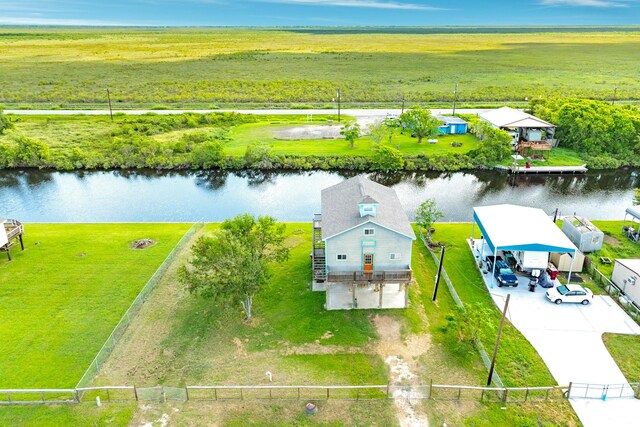 aerial view with a rural view and a water view